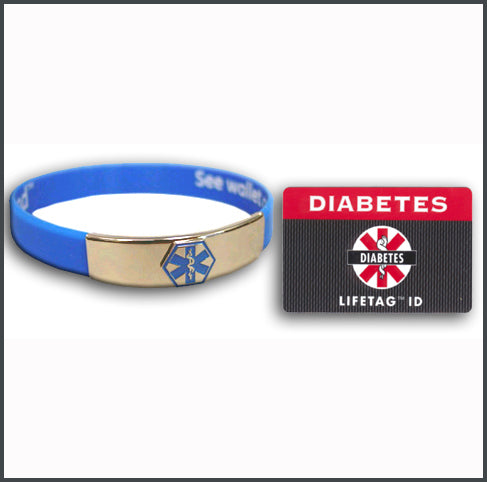 A blue rubber LIFETAG Medical ID Bracelet featuring a central metal plate with a generic medical symbol. The inside of the bracelet is printed with the instruction "See Wallet Card" to guide emergency personnel.