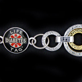 A stylish, two-toned LIFETAG Medical ID bracelet featuring a designer link band made from durable stainless steel accented with rich gold cladding. The central ID plate is integrated into the elegant, contrasting design.